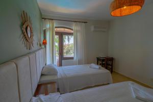 Postel nebo postele na pokoji v ubytování Xanthos Boutique Hotel Patara