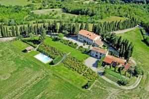 an aerial view of a house with a lot of trees at Villa Poggio dei Cipressi in Subbiano