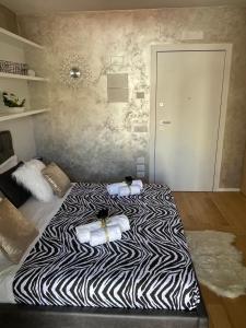 Postel nebo postele na pokoji v ubytování Palazzo Metropolis