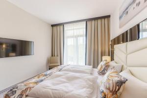 Łóżko lub łóżka w pokoju w obiekcie Apartament z aneksem kuchennym i basenem 426 Diune Hotel Resort