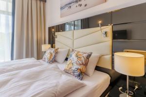 Łóżko lub łóżka w pokoju w obiekcie Apartament z aneksem kuchennym i basenem 426 Diune Hotel Resort