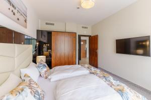 Łóżko lub łóżka w pokoju w obiekcie Apartament z aneksem kuchennym i basenem 426 Diune Hotel Resort