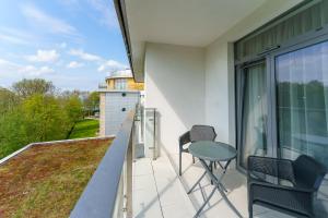 Balkon lub taras w obiekcie Apartament z aneksem kuchennym i basenem 426 Diune Hotel Resort