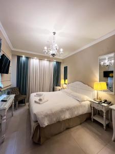 Кровать или кровати в номере Anemolia Resort and Spa