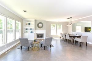 a dining room with a table and chairs and a fireplace at Sonoma Vista Dreams in Sonoma
