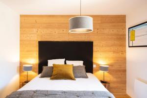 Ένα ή περισσότερα κρεβάτια σε δωμάτιο στο TERRESENS - L'ETENDARD