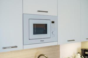 Kuchnia lub aneks kuchenny w obiekcie Apartament z aneksem kuchennym i basenem 426 Diune Hotel Resort