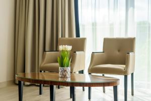 Część wypoczynkowa w obiekcie Apartament z aneksem kuchennym i basenem 426 Diune Hotel Resort