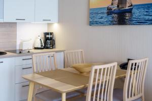 Kuchnia lub aneks kuchenny w obiekcie Apartament z aneksem kuchennym i basenem 426 Diune Hotel Resort