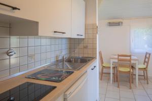 Kjøkken eller kjøkkenkrok på HelloElba Villetta Azzurra