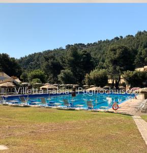 a large swimming pool in a resort at Le Macine Pugnochiuso Holidays in Vieste