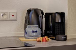a coffee maker sitting on top of a counter at homie stay Alte Brauerei - am Main Ochsenfurt in Ochsenfurt