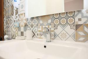 a bathroom with a sink and a mirror at Country Villa San Vito Bay in San Vito lo Capo +37 photos