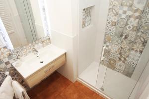 a bathroom with a sink and a shower at Country Villa San Vito Bay in San Vito lo Capo