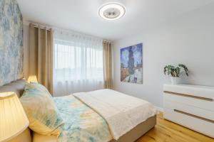 Łóżko lub łóżka w pokoju w obiekcie Apartament Doro