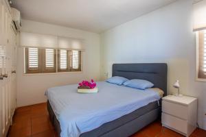 Postel nebo postele na pokoji v ubytování Villa Coral Breeze + 9 fotografií