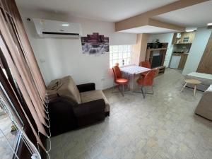 a living room with a couch and a table at Studio Kovacevic in Gornja Toplica