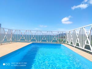 a swimming pool on the balcony of a building at Villa bel azur in Antsiranana