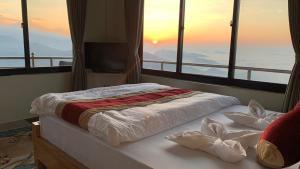 Katil atau katil-katil dalam bilik di Hotel Pristine Himalaya