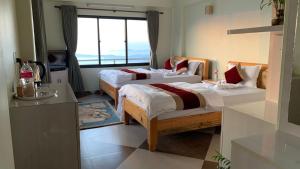 Katil atau katil-katil dalam bilik di Hotel Pristine Himalaya