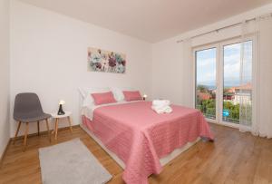 Postel nebo postele na pokoji v ubytování Apartment Nona - Center, 150 meters from the beach