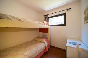 A bed or beds in a room at Appartamento Laura Még 7 kép