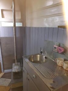 a kitchen with a sink in a room at South View Shepard Hut 