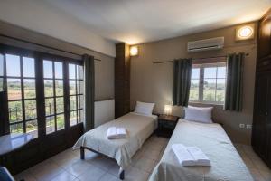 Posteľ alebo postele v izbe v ubytovaní Villa Georgina B&B