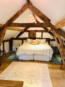 a bedroom with a bed in an attic at The Cottage, Winley Farm in Bromyard