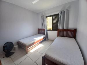 Postel nebo postele na pokoji v ubytování Lindo apartamento com vista para o mar em Caraguá!