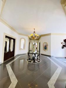 a large room with a table in the middle of it at Velver Mansion, Malta - Luxury Villa with Pool in Naxxar