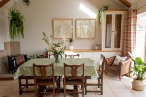 a dining room with a table and chairs at Wressle Grange (farmhouse) in Selby