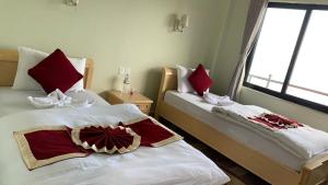 Katil atau katil-katil dalam bilik di Hotel Pristine Himalaya