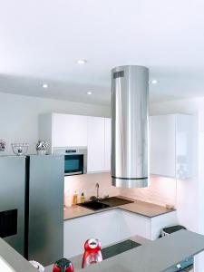 A kitchen or kitchenette at EIFFEL TOWER PENTHOUSE