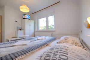 Postel nebo postele na pokoji v ubytování Apartments and Rooms Banić