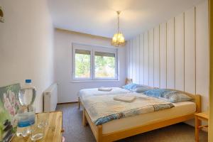Postel nebo postele na pokoji v ubytování Apartments and Rooms Banić