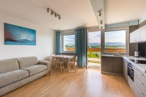 Televízia a/alebo spoločenská miestnosť v ubytovaní Apartament TOP FLOOR