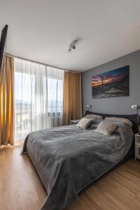 Posteľ alebo postele v izbe v ubytovaní Apartament TOP FLOOR