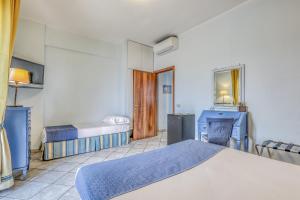Hotel Albatros Varigotti客房内的一张或多张床位