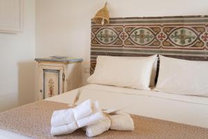 Posteľ alebo postele v izbe v ubytovaní Tenuta Puloni