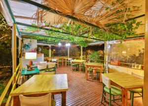 a restaurant with tables and chairs and plants at DuruPduru Kaş in Kaş