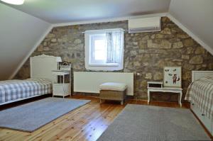 Postel nebo postele na pokoji v ubytování Nemespécsely Udvarház