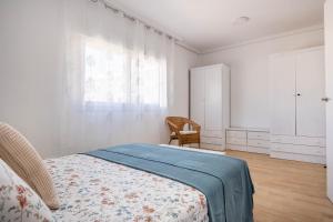 Łóżko lub łóżka w pokoju w obiekcie Apartamento Isbilya