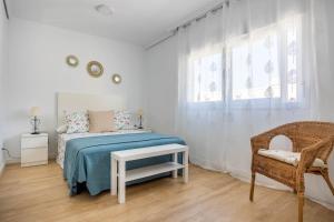 Łóżko lub łóżka w pokoju w obiekcie Apartamento Isbilya