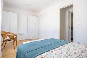 Łóżko lub łóżka w pokoju w obiekcie Apartamento Isbilya