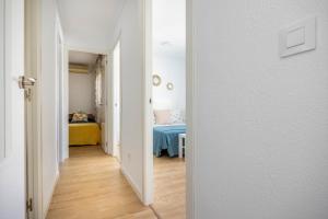 Łóżko lub łóżka w pokoju w obiekcie Apartamento Isbilya