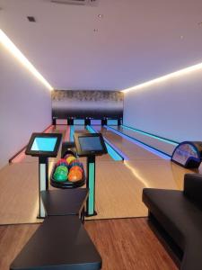 a bowling alley with a bowl of balls in the lanes at Salinas Premium Resort in Salinópolis