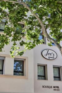 a sign on the side of a building at JOE'S GOMILA BOUTIQUE HOTEL in Palma de Mallorca
