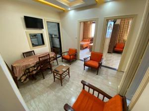 a view of a living room with a table and chairs at Villa Teba - Marouf Group in Ras El Bar