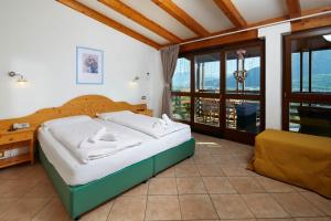 Postel nebo postele na pokoji v ubytování Hotel Garnì San Giorgio